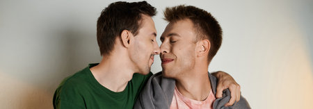 Two men share a tender moment, embracing each other with joy.の写真素材
