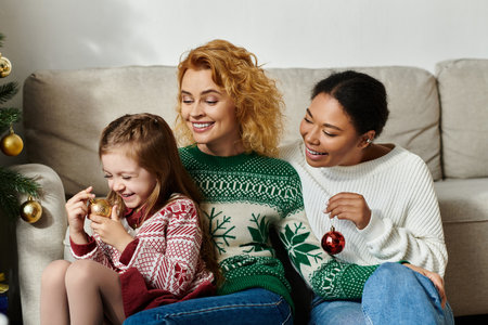 A joyful family decorates for the holidays, sharing laughter in their cozy living room.