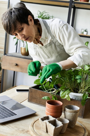 A dedicated gardener tends to her plants with care in a serene workspace.