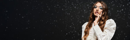 The young woman stands gracefully, exuding elegance and charm in a striking outfit.