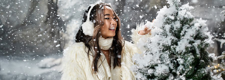 Delightful celebration of Christmas with snowflakes falling as a person enjoys the festive spiritの写真素材