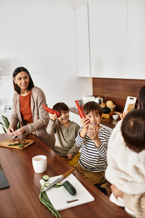 Winter holiday spirit shines as a happy Asian family joyfully prepares baked treats together in...