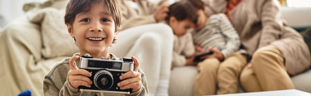 A cheerful gathering of an Asian family sharing laughter and warmth during Christmas, boy holding...