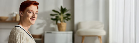 A joyful young man in festive attire expresses happiness during a Christmas celebration at home.の写真素材