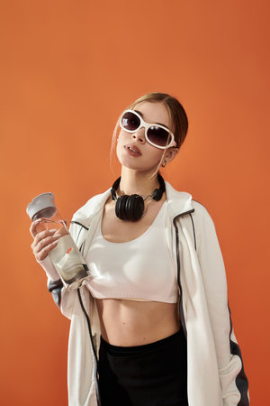 A passionate athlete captures attention with her stylish pose, embodying fitness and confidence.