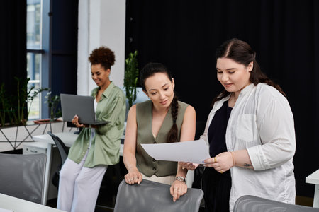 Three professionals engage in teamwork, discussing documents and sharing ideas in an office.