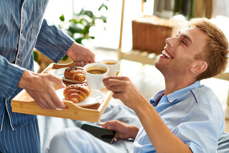 A joyful morning unfolds as a loving couple enjoys breakfast together while lounging in their...