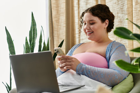 Radiant woman holding her laptop while at home.