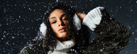 A stunning brunette woman showcases stylish winter wear, featuring earmuffs and a cozy faux fur...