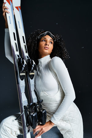 A stylish brunette woman showcases her winter fashion while holding skis in a trendy studio...