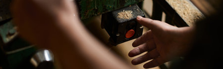 In a lively workshop, a female carpenter fine-tunes her equipment while working on a wood project.