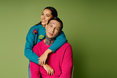 A couple shares a joyful moment with their arms around each other, exuding warmth and love.