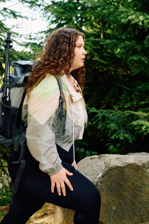 A confident plus size woman explores the rich beauty of nature in a lush green environment.