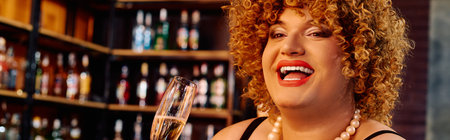 A drag queen with extravagant makeup joyfully performs on stage during a festive holiday event.