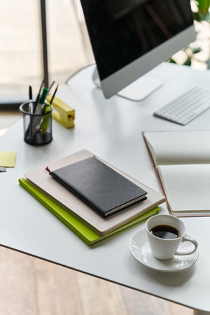modern workspace with notebooks and stationeryの写真素材