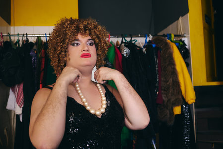 A drag performer getting ready for an exciting holiday show backstage.の写真素材