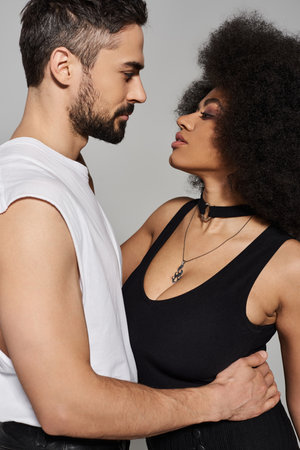 A couple shares a tender gaze, embodying love and connection in their passionate moment.