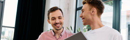 The couple shares laughter and conversation while enjoying their time in a cozy office.の写真素材