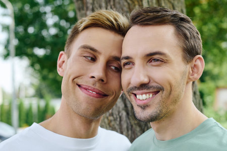 A charming couple enjoys a warm day, embracing joy and love in natures beauty.の写真素材