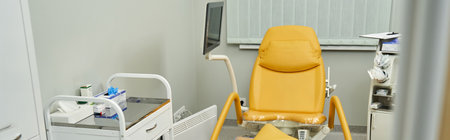 A bright, clean gynecological clinic with advanced exam chairs for female health care.の写真素材