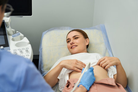 A skilled gynecologist conducts a patient examination focused on reproductive health.の写真素材