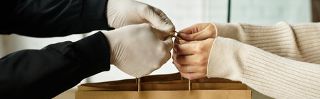 A delivery man is preparing to hand over an order to a recipient in an office setting.