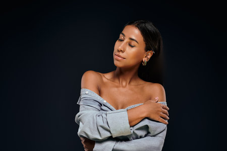 A confident African American woman showcases her natural beauty.の写真素材