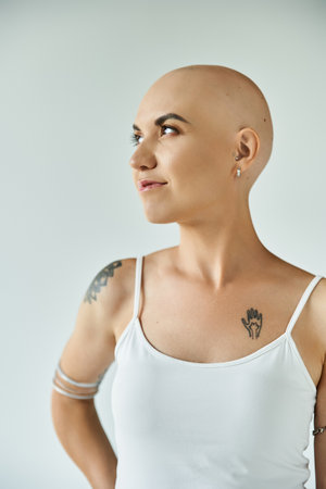 A young woman with alopecia showcases her unique beauty, embracing confidence and strength.の写真素材