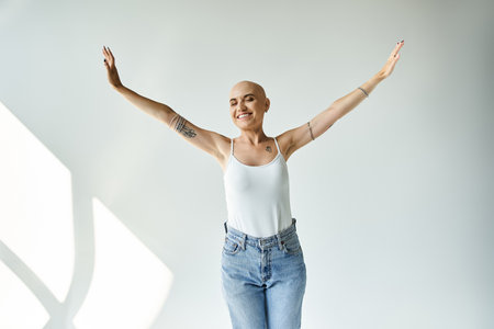 A confident young woman shows her radiant smile while celebrating her individuality.の写真素材