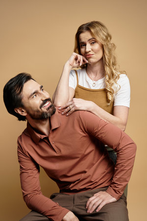 A man and woman share a lighthearted interaction, showcasing their candid connection.