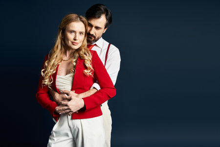 A middle aged couple showcases their love, dressed in stylish outfits, creating a heartfelt moment.の写真素材