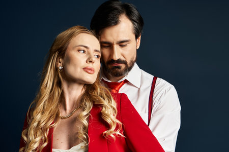 A middle aged couple embraces warmly, conveying passion and connection in their attire.の写真素材