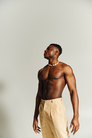 A young and handsome African American man stands tall with a strong presence.の写真素材