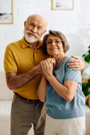 A loving senior couple enjoys a heartfelt moment at home, supporting each other through diabetes.の写真素材