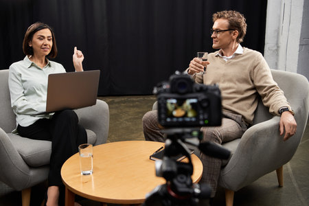 In a contemporary studio, a journalist engages a specialist over an interesting discussion,...