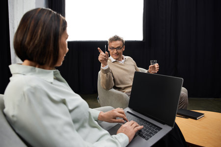 A middle-aged female journalist engages in an insightful interview with a specialist in a serene...