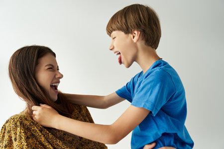 A joyful moment shared in the studio, showcasing the bond of family through laughter and play.の写真素材