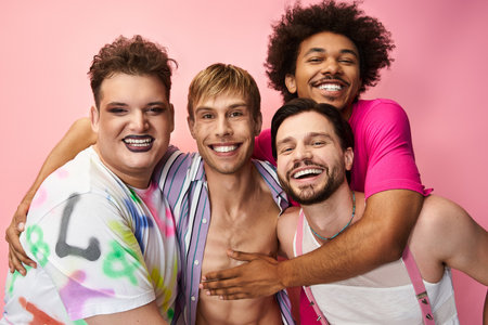 A group of four joyful friends embraces each other, showcasing their vibrant spirits and pride.の写真素材