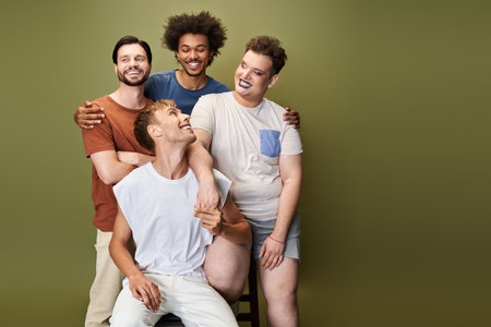 Four individuals enjoy a moment of happiness and connection, expressing their vibrant LGBTQ pride.の写真素材