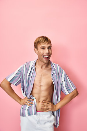 A cheerful person with a bright smile showcases their vibrant outfit with pride.の写真素材