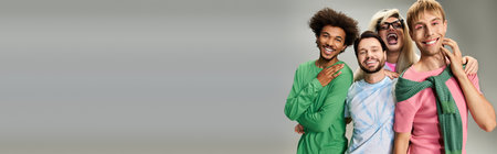 A group of four queer friends joyfully express their identity through colorful clothing.の写真素材