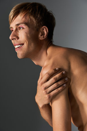 A vibrant person smiles confidently, showcasing bold self expression and embracing their identity.の写真素材