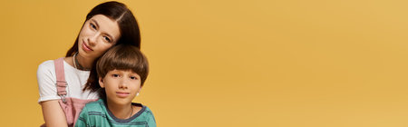 A bright studio captures the love and bond between a mother and son.の写真素材