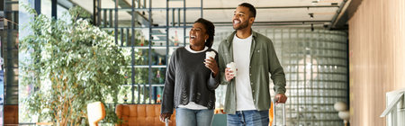 A joyful couple strolls through a hotel lobby, sharing drinks and laughter on their vacation...