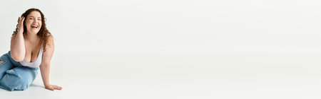 Confident young woman in stylish attire radiates happiness while posing gracefully indoorsの写真素材