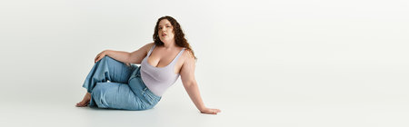 Trendy young woman poses elegantly in a contemporary setting, showcasing her unique fashion sense.の写真素材