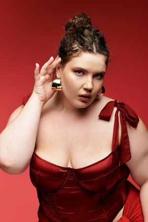 A young woman exudes elegance in a chic ensemble while posing gracefully for a fashion portrait.の写真素材