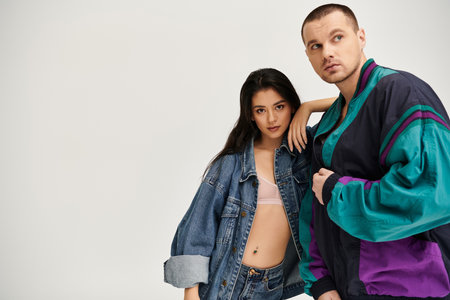 Beautiful young couple showcases romance and style in a chic studio setting for Valentines Day.の写真素材