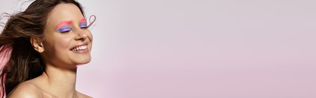 A young woman displays her captivating beauty with striking pink eyebrows and purple eyeshadow, bannerの写真素材