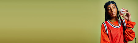 A stylish young woman enjoys a vibrant dessert, radiating confidence.の写真素材